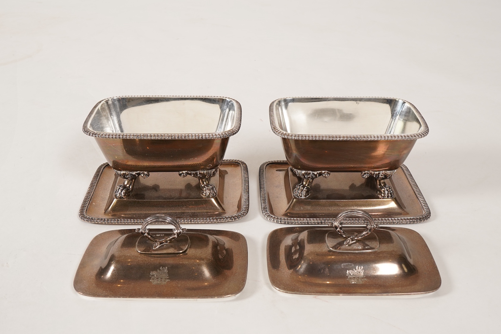 A pair of George IV silver sauce tureens with covers and integral stands, by Philip Rundell